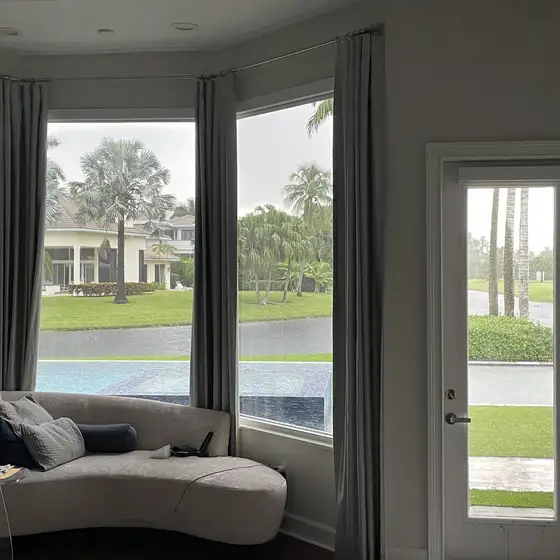 Clear bay windows looking out to a lake
